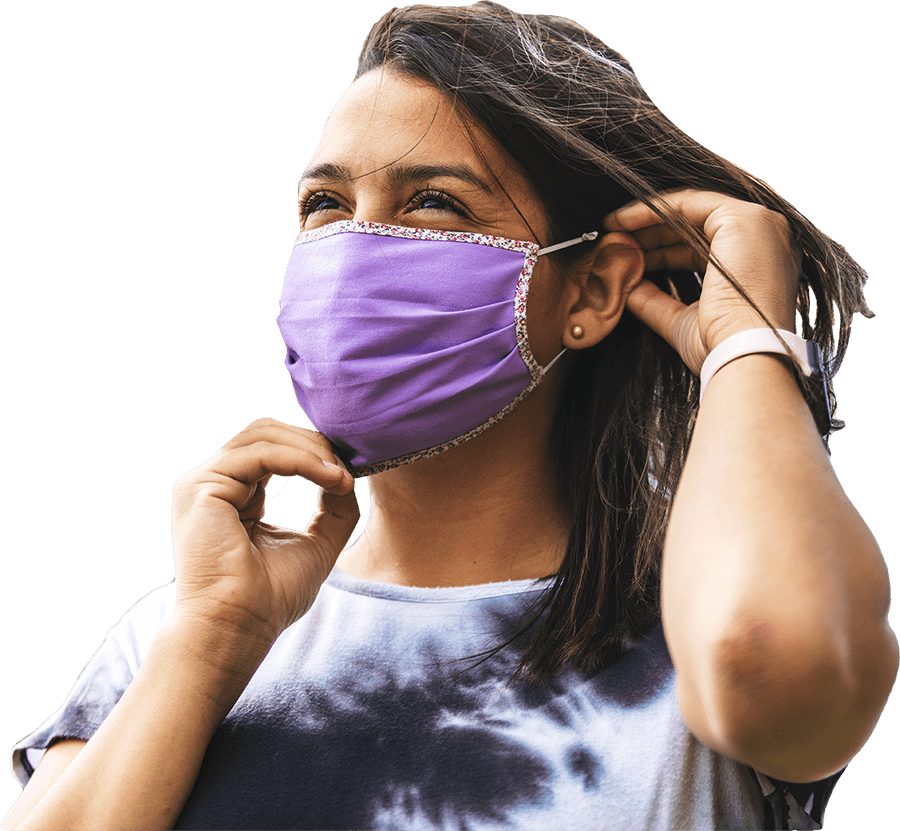 family wearing masks looking at camera